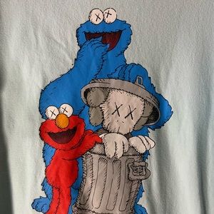 Uniqlo x kaws x Sesame Street trash companion powder blue graphic tee